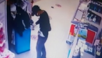 Marketteki silahlı soyguncu kameraya yakalandı