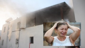 Evindeki yangını gözyaşlarıyla izledi