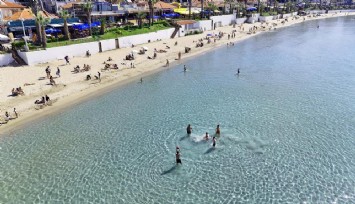 Kuşadası'nda sıcaklık 29 dereceyi bulunca plajlar doldu, taştı