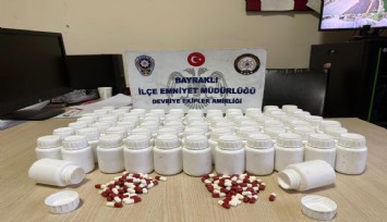 Mezarlıkta  bulduğu poşetin içinden uyuşturucu hap çıktı
